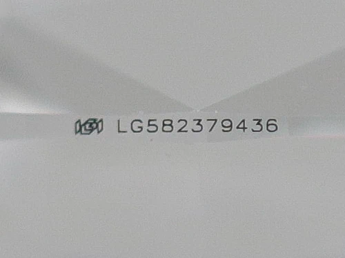 zoomed in photo of IGI serial number laser inscribed on a lab grown diamond